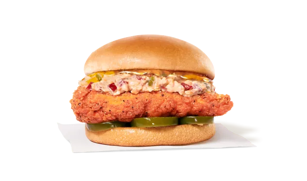 Honey Pepper Pimento Chicken Sandwich with chicken filet, pimento cheese, pickled jalapeños, and honey drizzle