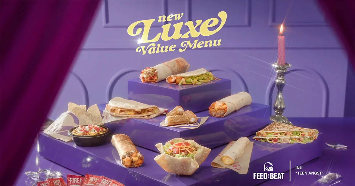 Silver cloche and luxury table setting at a Taco Bell drive-thru window