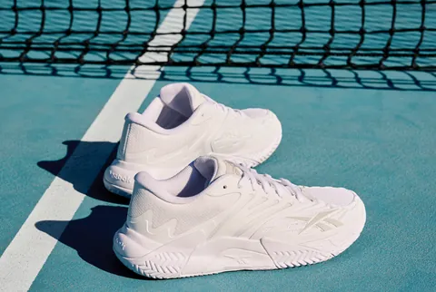 White Reebok Phase Evo performance tennis shoe shown against a plain background