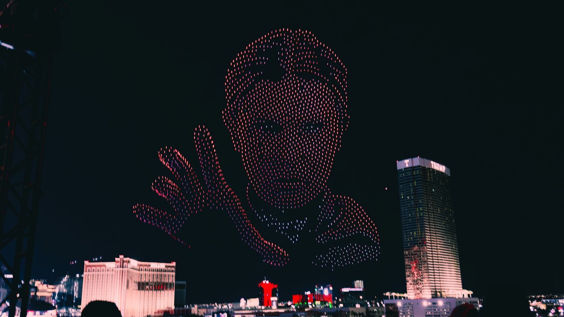 Giant Vecna character from Stranger Things formed by illuminated drones above a city skyline