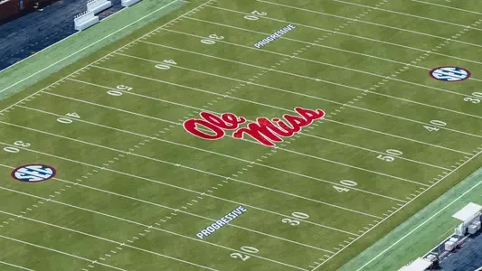 Progressive logo painted on a college football field as part of the on-field branding program