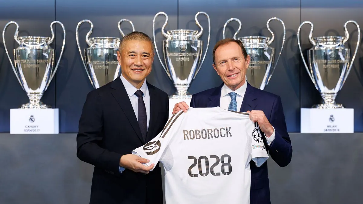 Real Madrid and Roborock representatives at the signing announcement for their global strategic cleaning-vacuum partnership