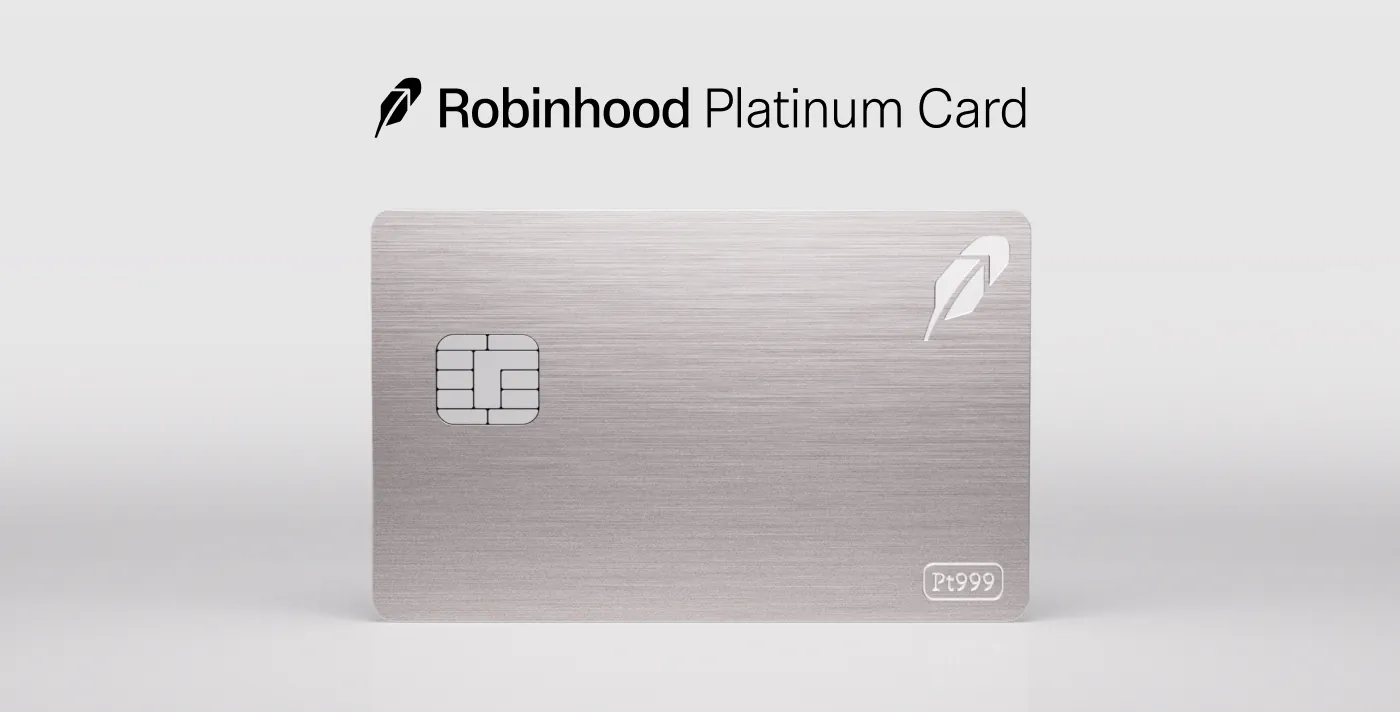 The Robinhood Platinum Card held at an angle with a dark body and brushed metallic finish