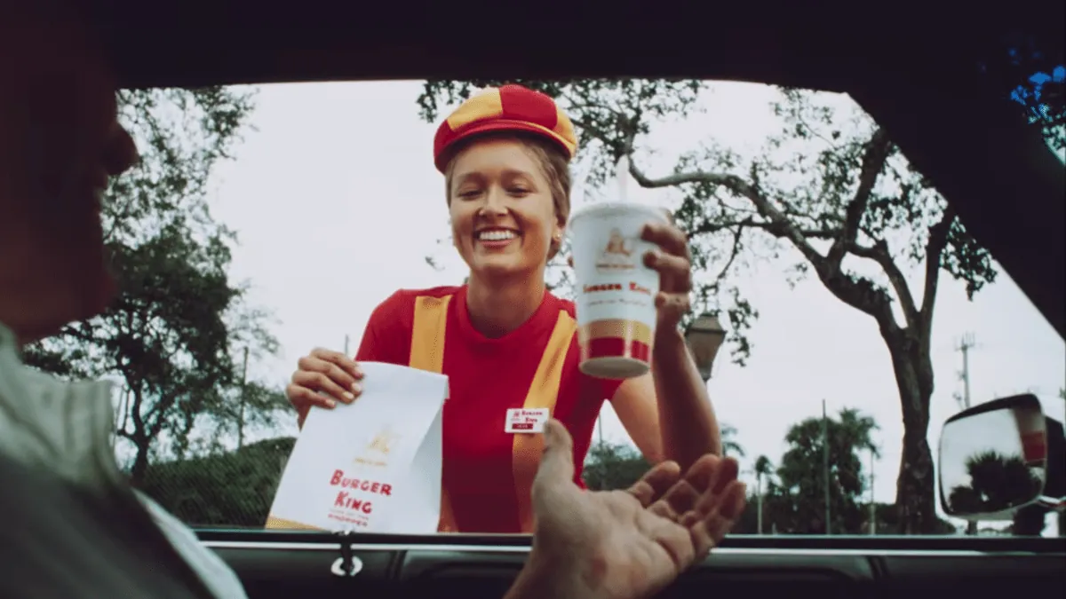 Crown held above a customer's head in Burger King's There's A New King And It's You Oscars campaign